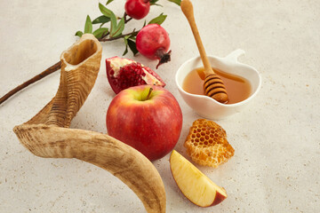 Rosh hashanah, jewish New Year holiday concept. Pomegranate, apples and honey traditional products...