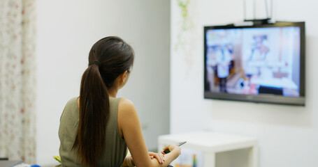 Woman watch TV at home