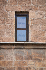 Fototapeta na wymiar Detail of wooden window in medieval building