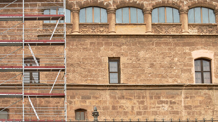 Repair with scaffolding of old building