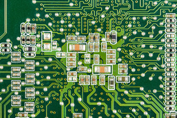 Resistors, capacitors, transistors on an electronic computer printed circuit board