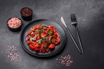 A salad of baked mushrooms, tomatoes, onions, parsley, spices and herbs