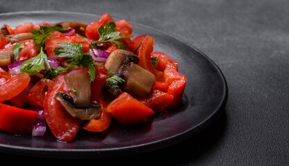 A salad of baked mushrooms, tomatoes, onions, parsley, spices and herbs