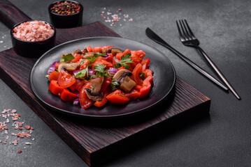 A salad of baked mushrooms, tomatoes, onions, parsley, spices and herbs