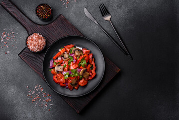 A salad of baked mushrooms, tomatoes, onions, parsley, spices and herbs