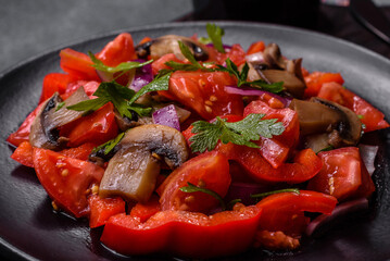 A salad of baked mushrooms, tomatoes, onions, parsley, spices and herbs