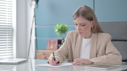 Tense Upset Businesswoman Trying to Write a Letter