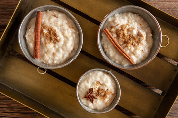 Traditional Scandinavian-style rice porridge, pudding with honey. Close up, top view.