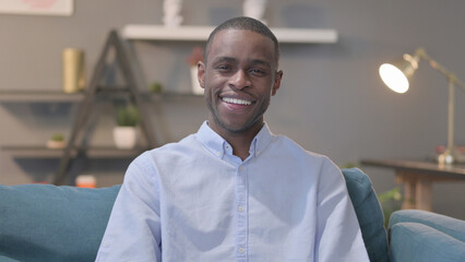 Portrait of African Man Smiling at the Camera, Sofa