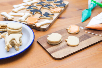 Process of decorating cookies for Halloween. Homemade pastry.