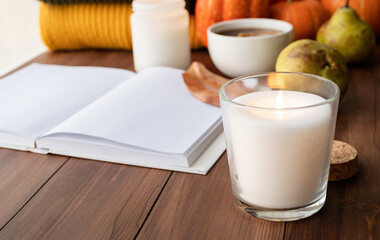 High angle view autumn composition with sweaters and candles, mockup design