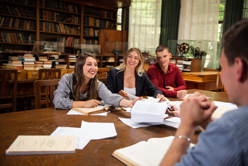 Group of students studying together at the University library