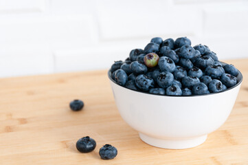 Blueberries in a white cup. Blueberry berries. Selective Focus.