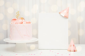 Vertical white blank poster mockup stands with birthday pink cake and birthday cap and holiday...
