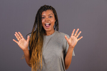 Young Afro woman Brazilian, surprised and amazed. scare