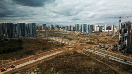 Construction site of a new city block. Construction of multi-storey buildings. Aerial photography.