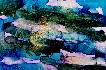 Golden dust on dark blue and green Alcohol ink fluid abstract texture fluid art with gold glitter and liquid.