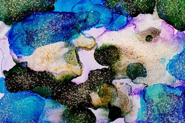 Golden dust on dark and light blue Alcohol ink fluid abstract texture fluid art with gold glitter and liquid.