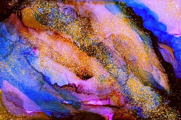 Free flowing and falling golden dust on Alcohol ink fluid abstract texture fluid art with gold glitter and liquid.