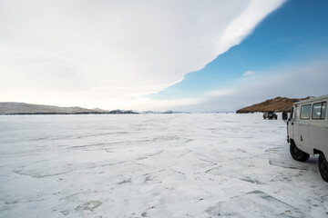 frozen Lake Baikal and clear blue sky split in half
