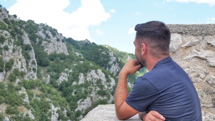 portrait of a man against the background of mountains. Copy space