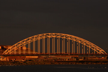 The bridge over the river the North near the village of Alblasserdam by night