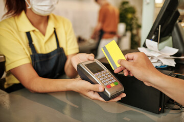 Customer Swiping Credit Card