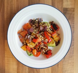 Plant based meal of barley, red peppers, avocado and dried apricots