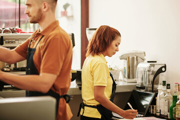 Fototapeta na wymiar Young People Working in Coffeeshop