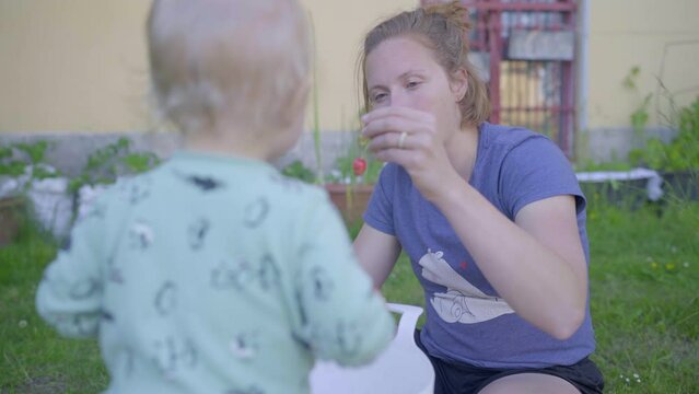 Mother Eating Cherry By Baby Boy In Backyard - Jablonec nad Nisou, Czech Republic