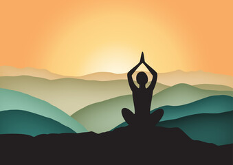 silhouette of a yoga person meditating at sunrise