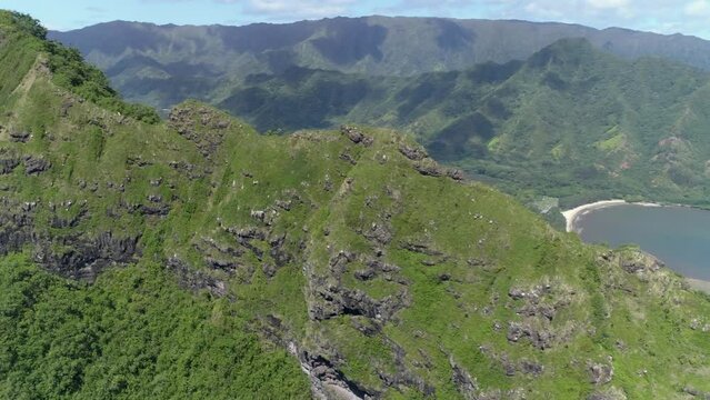 Aerial drone view of the Kahana Bay surrounded by Koolau Mountains