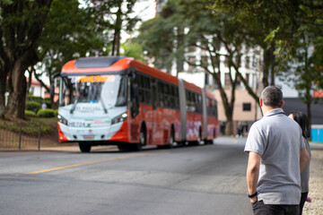 Man looking at curitiba bus. Curitiba 04-22-2022