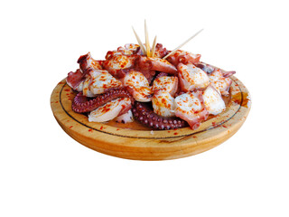 Pulpo a la gallega in Spanish meaning Galician-style octopus  or polbo a feira meaning fair-style...