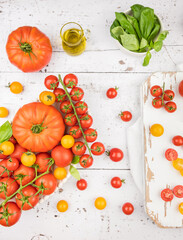 colorful tomatoes on white background