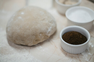 Fototapeta na wymiar Ready-made dough for baking bread on the table
