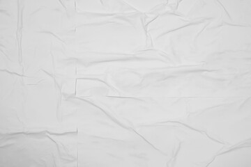 Top view of white creased blank poster as background, closeup