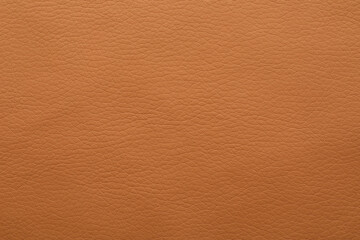 Fototapeta premium Texture of orange leather as background, closeup