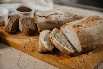 Several types of bread sliced on the table