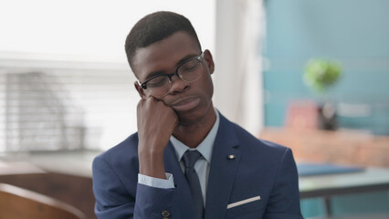 Tired Young African Businessman Sleeping
