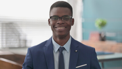 Young African Businessman Smiling at Camera