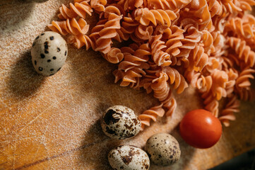 Background texture of tricolor fusilli pasta for traditional Italian and Mediterranean cuisine in a close up full frame view