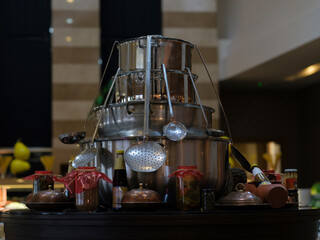 large pots and ladles in a kitchen