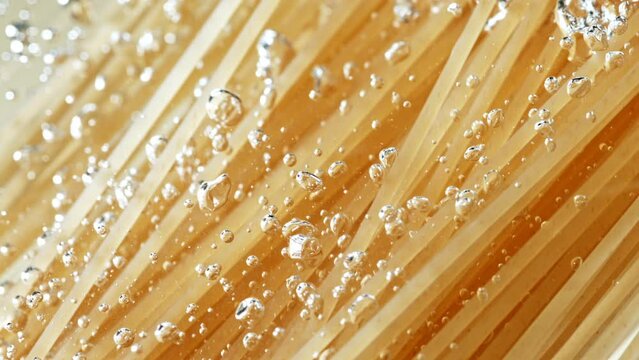 Super slow motion of flying Italian pasta Spaghetti into water. Filmed on high speed cinema camera, 1000 fps.