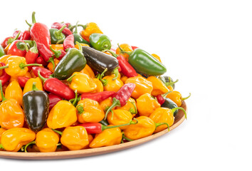 Bunch of Colorful Hot Peppers on a Tray Isolated on White
