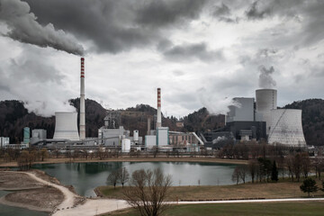 Co2-rich emission and water vapor rising from a thermal power plant chimneys and towers, aerial...