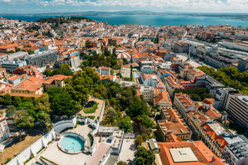 wide angle aerial drone view of Baixa District in Lisbon, Portugal with major landmarks visible