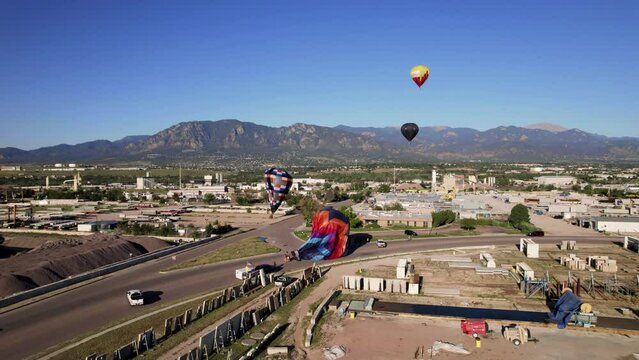 Hot Air Balloon Down in Road Colorado Springs 4K features a hot air balloon on the road after an emergency landing during the Labor Day celebration in Colorado Springs 2022 recorded with a drone