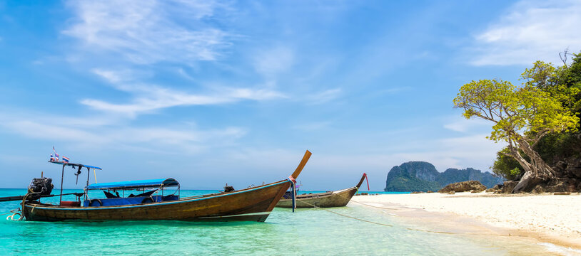 Amazing view of beautiful beach with traditional thailand longtale boat. Location: Bamboo island, Krabi province, Thailand, Andaman Sea. Artistic picture. Beauty world.