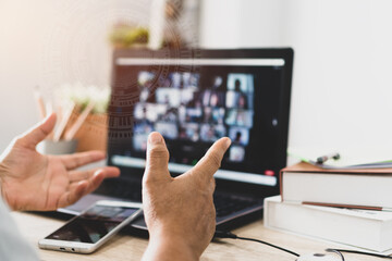 Online event or study briefing on conference to coworkers on laptop computer . Using smartphone...